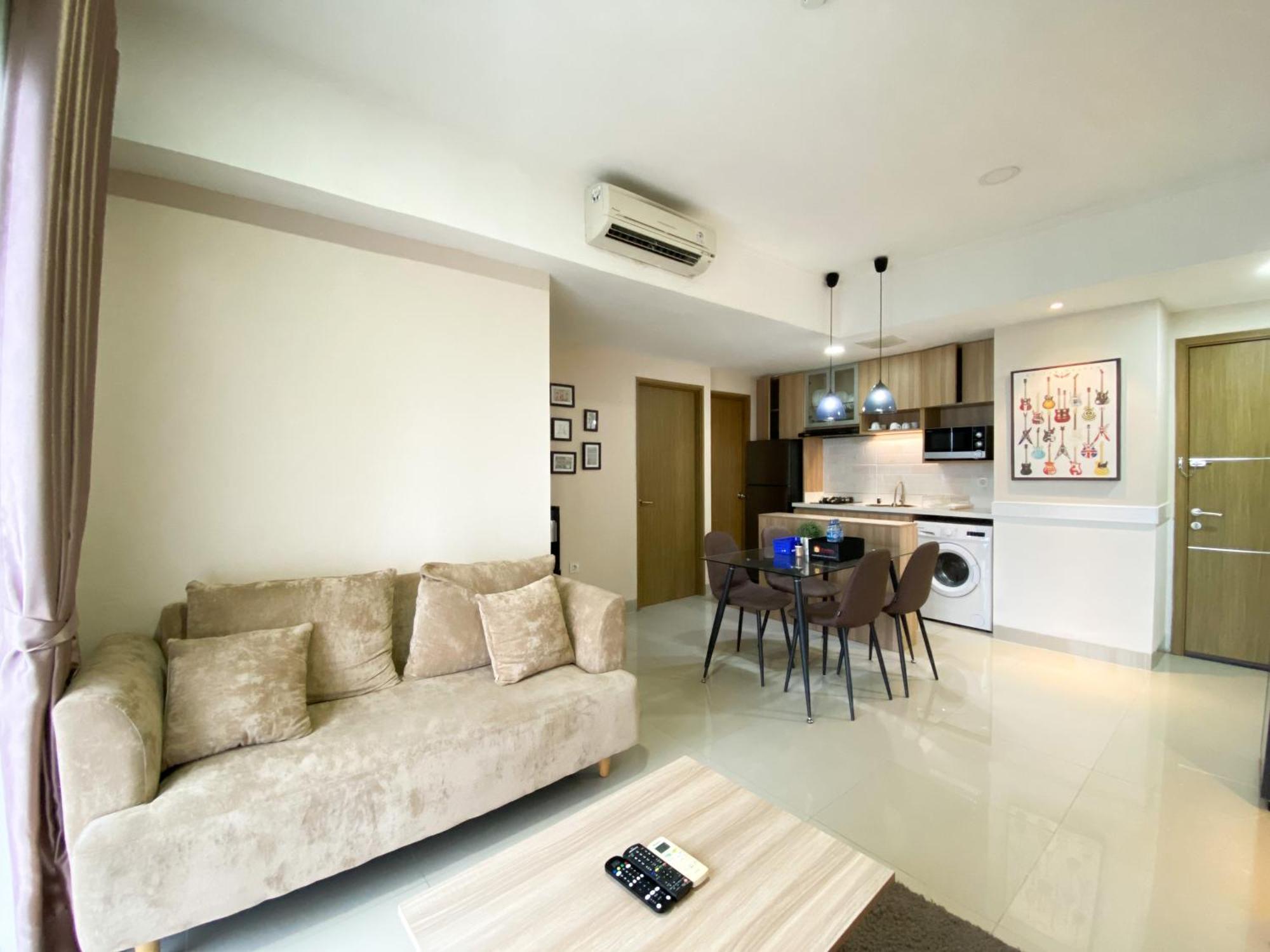 Cozy And Minimalist 2br At 8th Floor The Oasis Cikarang By Travelio Apartemen Bekasi